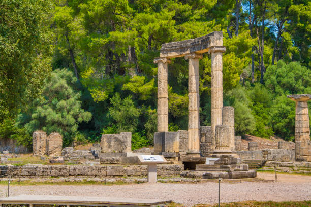 he Philippeion monument in the archaeological site of Olympia in Greece. Ancient Olympia is of the most influential ancient Greek sanctuaries, located in western Peloponnese, in Ilia Archaeological site of ancient Olympia in Peloponnese, Greece olimpia greece stock pictures, royalty-free photos & images